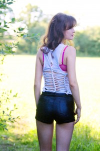 UK teen blogger wearing slashed vest style top over pink bra