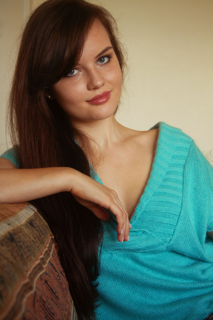 smiling-brunette-wearin-aqua-sweater