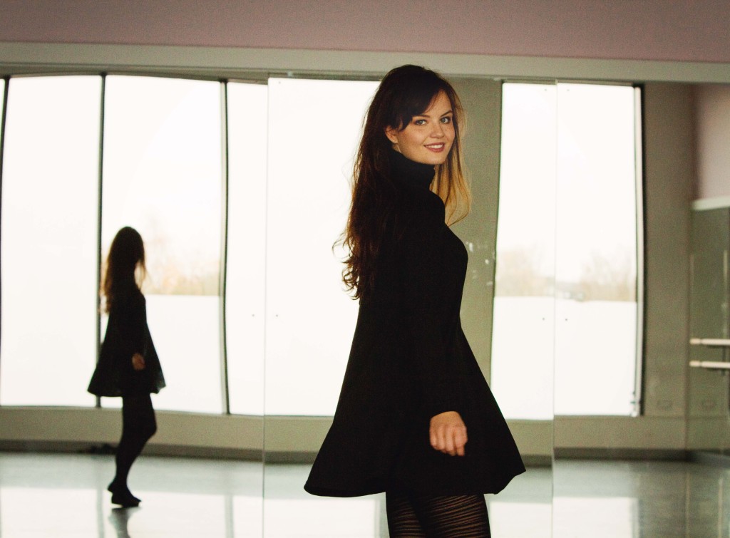 brunette-wearing-black-swing-dress