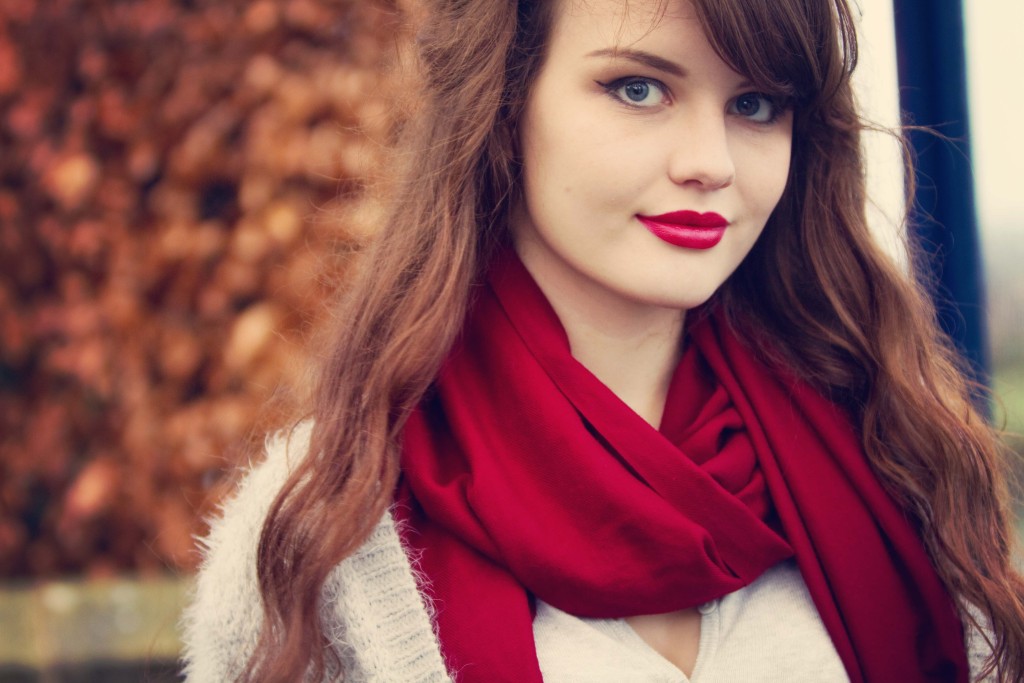 Teenage girl photgraphed against autumnul background