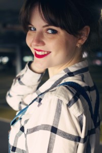 UK teen blogger smiling and wearing plaid shirt