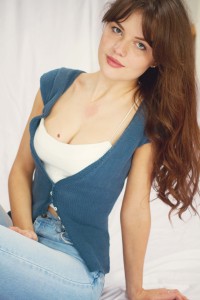 Navy fitted cardigan worn with white bralet
