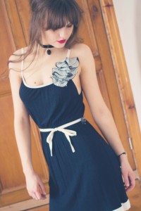 Black and cream gatsby style dress with floral detail and black choker necklace