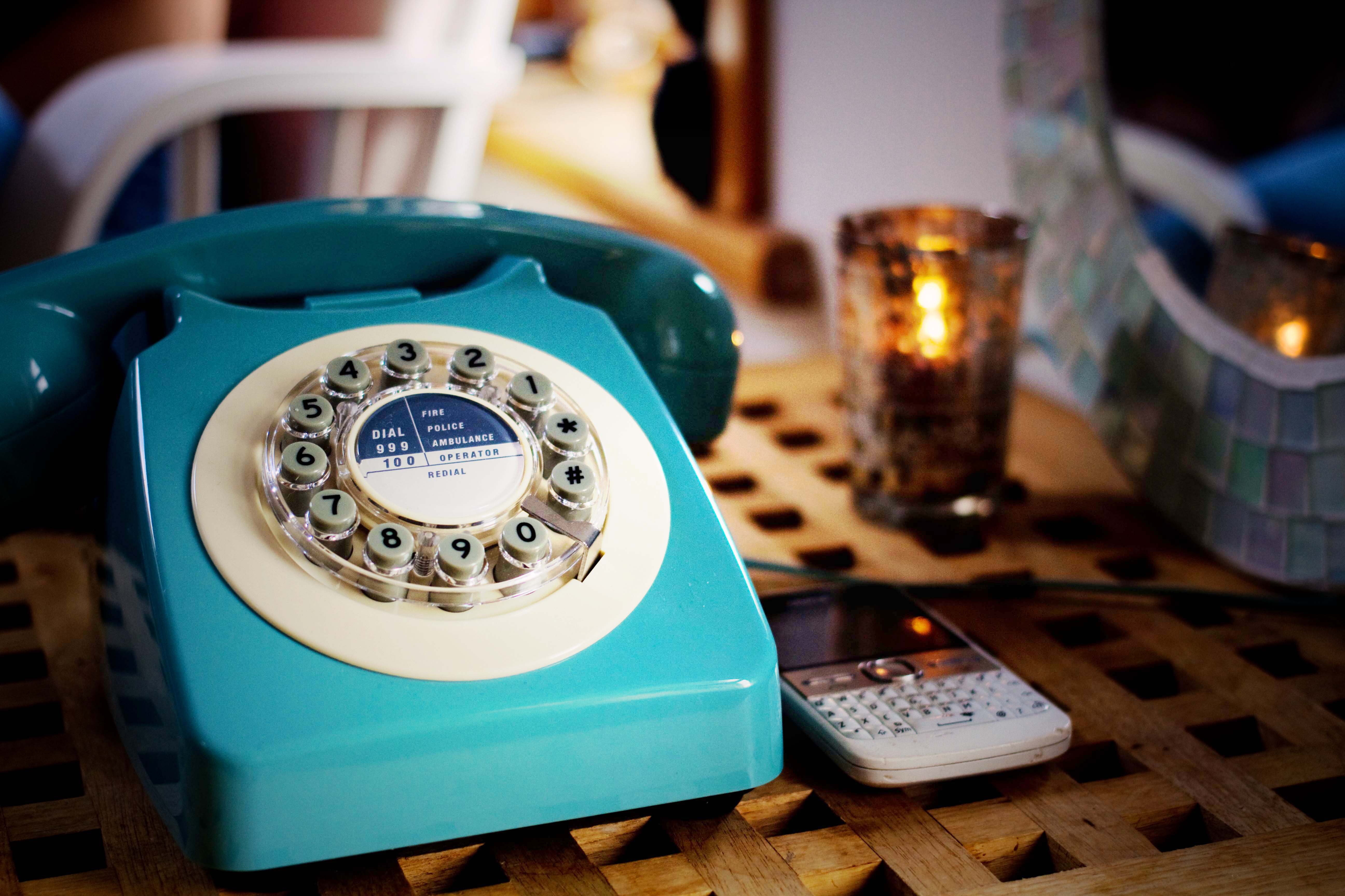 Blue vintage style telephone with dial