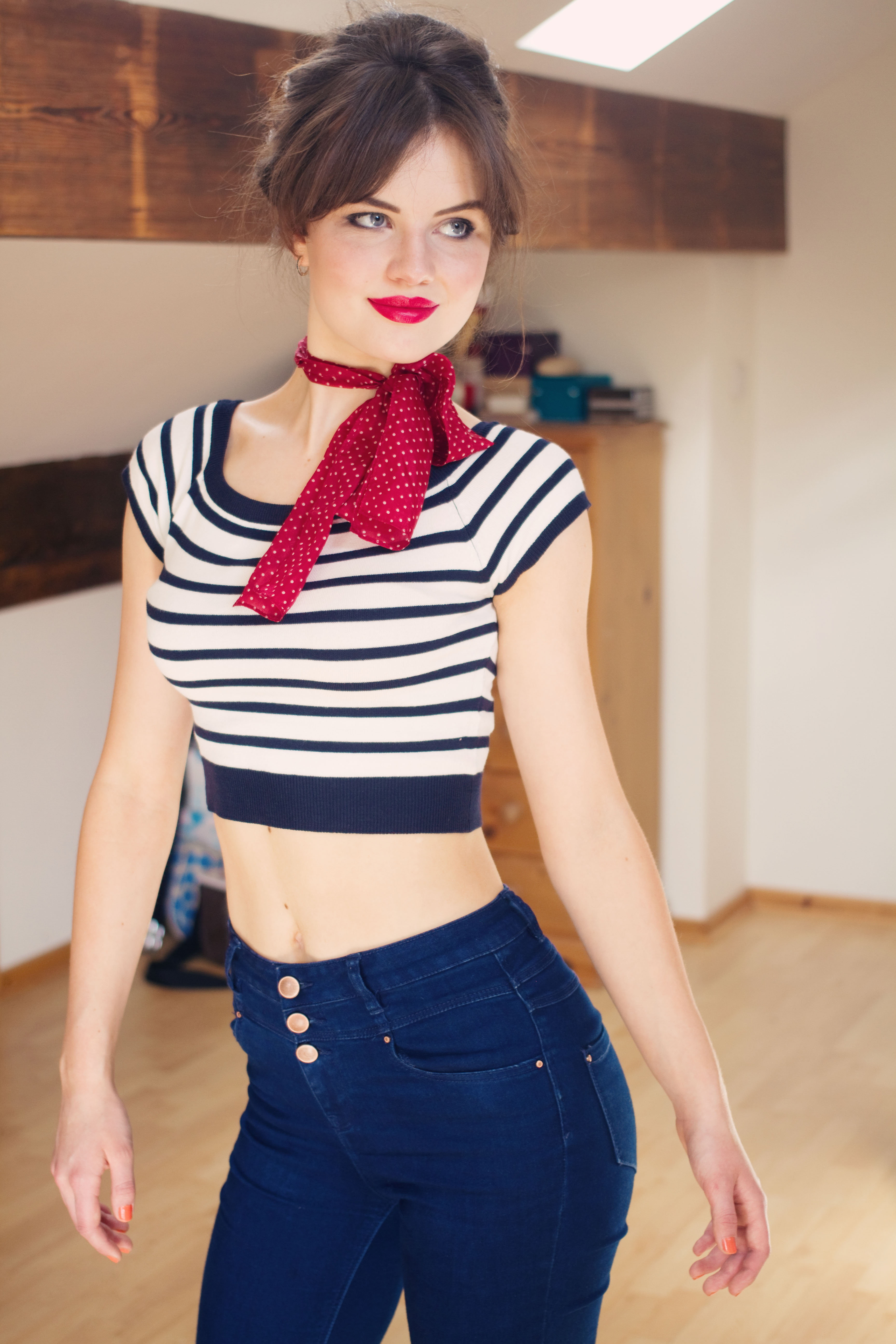 Portrait of teen girl wearing striped top and high waist jeans