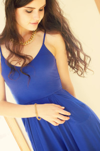 Brunette teen girl wearing blue camisole style dress