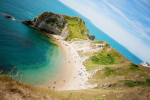 Beautiful beach on sunny day in Dorset UK. Blue sky blue sea