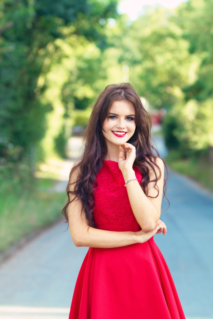 smiling-brunette-wearing-red-dress