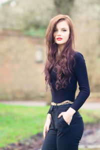 Teen girl wearing form-fitting all black outfit