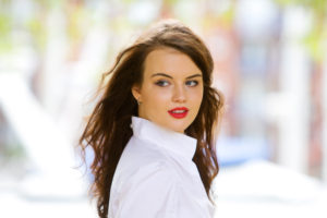 brunette teen with red lipstick and brunette hair