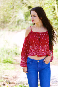 Brunete wearing jeans and red peasant top