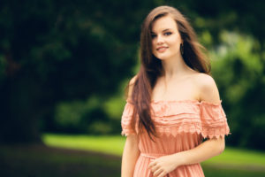 Smiling picture of girl in feminine dress