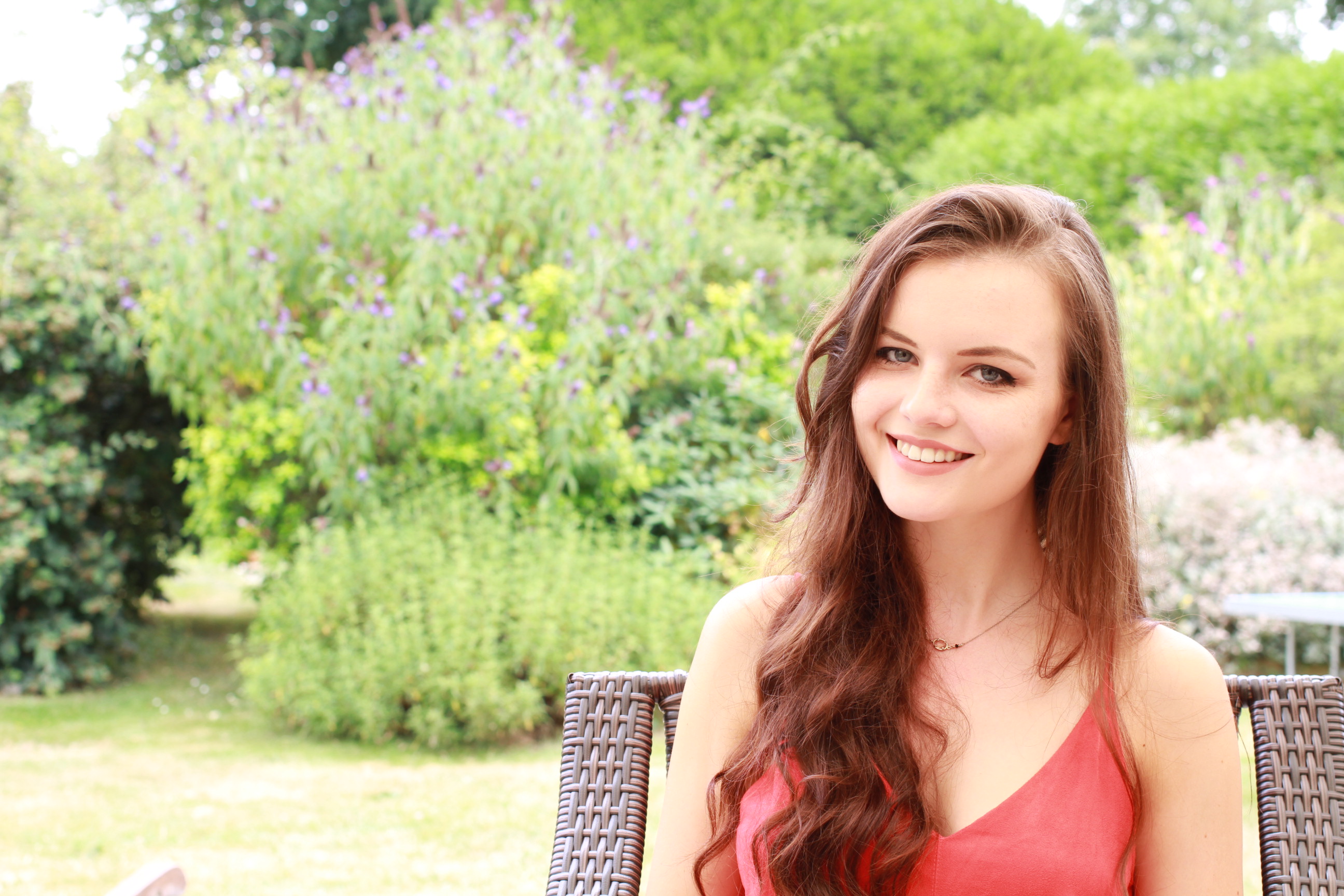 Brunette haired teen against garden background