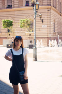 Teen girl wearing black playsuit from New Look.