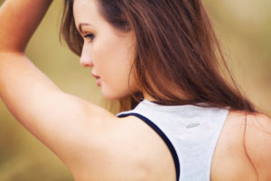 Back view of girl looking over shoulder.