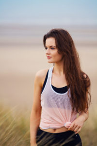 Girl looking to right. Beach background