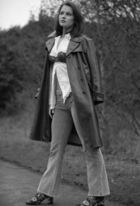 Girl wearing long leather coat