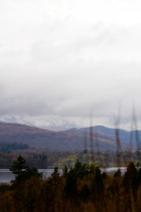 Moody skies lake and mountains landscape